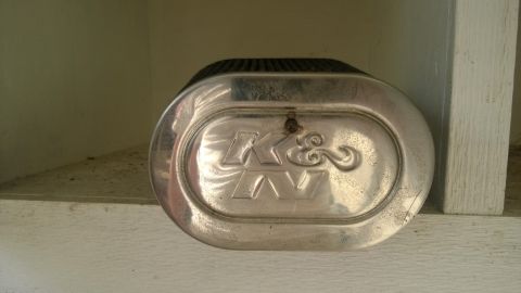 1994 Ford Bronco - A K&N air filter with its distinctive oval shape and embossed logo is shown.