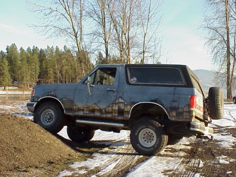 1989 Ford Bronco - This 1989 Ford Bronco is shown off-roading in a snowy, rural environment.