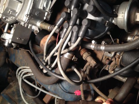 1973 Ford Bronco - Engine bay detail with carburetor and spark plug wires visible.