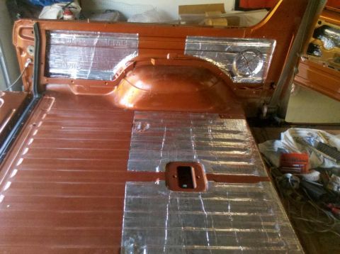 1982 Ford Bronco - Sound deadening material applied to the interior floor and wheel wells of a vehicle during a rebuild.