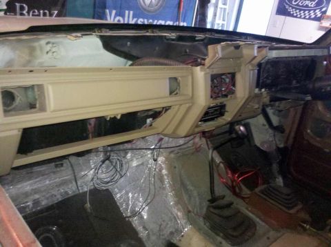 1982 Ford Bronco - Interior view of a vehicle undergoing repairs, with the dashboard removed and wiring exposed.