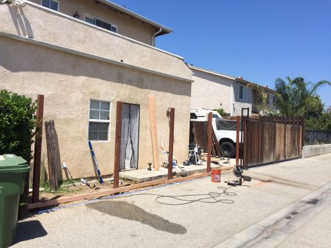 1968 Ford Mustang - A white pickup truck is visible behind a fence, with construction materials in the foreground.