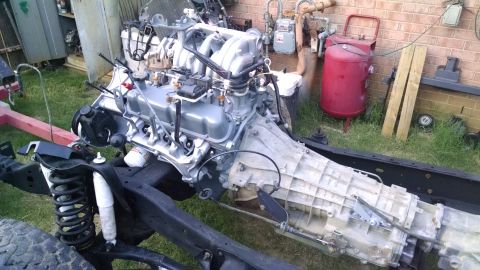 1993 Ford Bronco - The vacuum harness is on, and the trans dipstick tube has a fresh coat of paint. The trans heat shield, t-case vent bracket, & coil mount a…