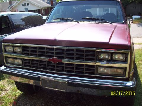 1989 Chevrolet Blazer - Front view of a maroon 1989 Chevrolet K5 Blazer, showing its grille and headlights.