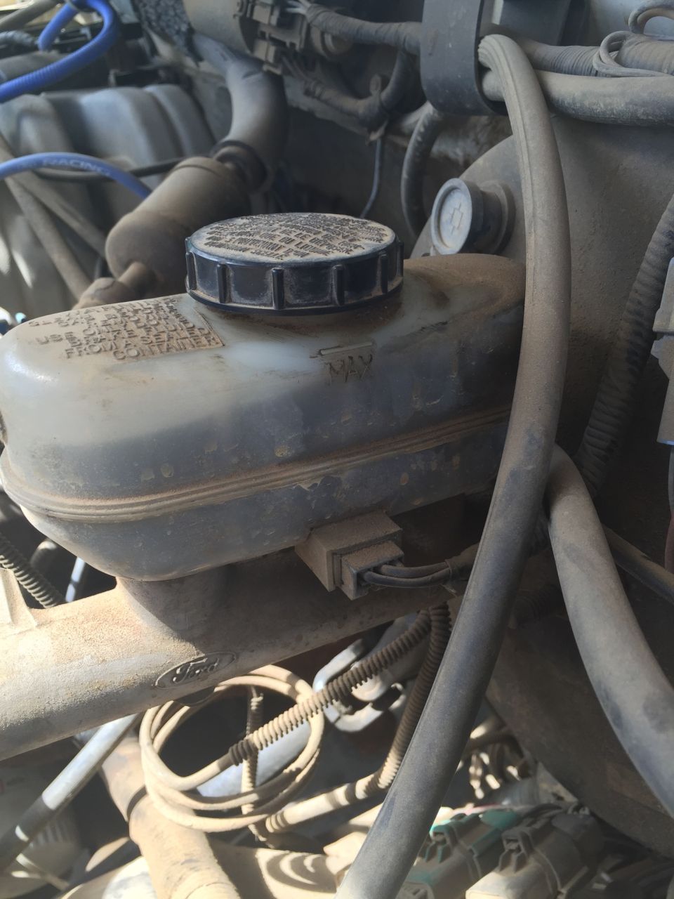 1991 Ford Bronco brake fluid reservoir with MAX and MIN markings