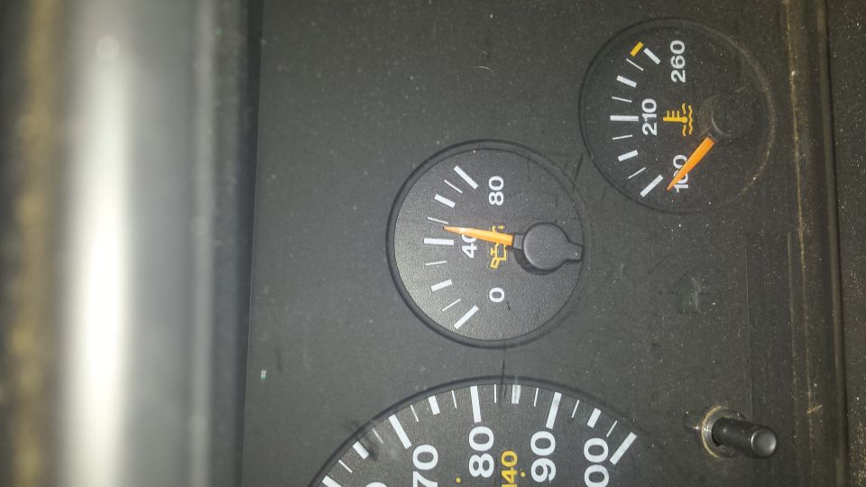 Dashboard gauges showing oil pressure and temperature