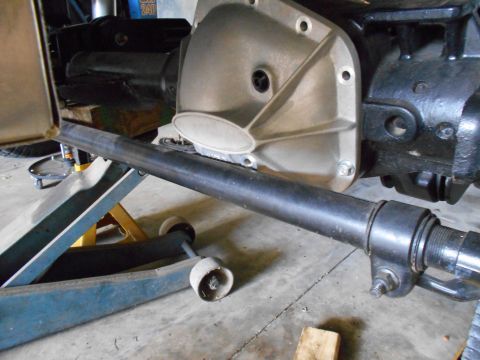 1992 Ford Bronco - Close-up of a vehicle's differential housing and axle assembly, supported by jack stands.