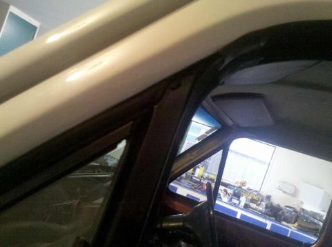 1982 Ford Bronco - Interior view of a vehicle, showing the A-pillar, headliner, and part of the dashboard.