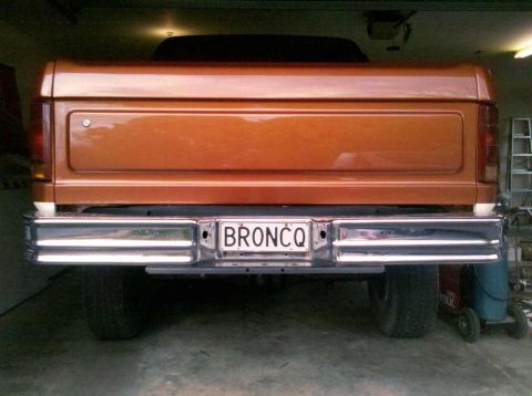 1982 Ford Bronco - Rear view of a 1982 Ford Bronco, showing its chrome bumper and license plate.