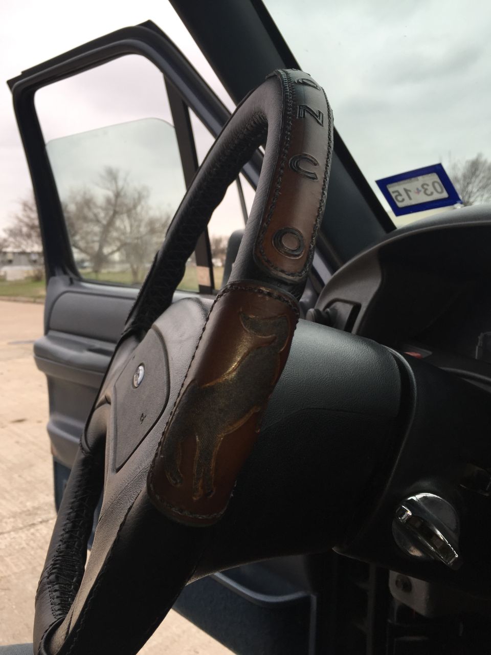 Steering wheel with embossed horse and "Bronco" lettering