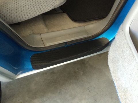 1995 Chevrolet Blazer - Close-up of a vehicle's interior door sill area, showing a carbon fiber protector.