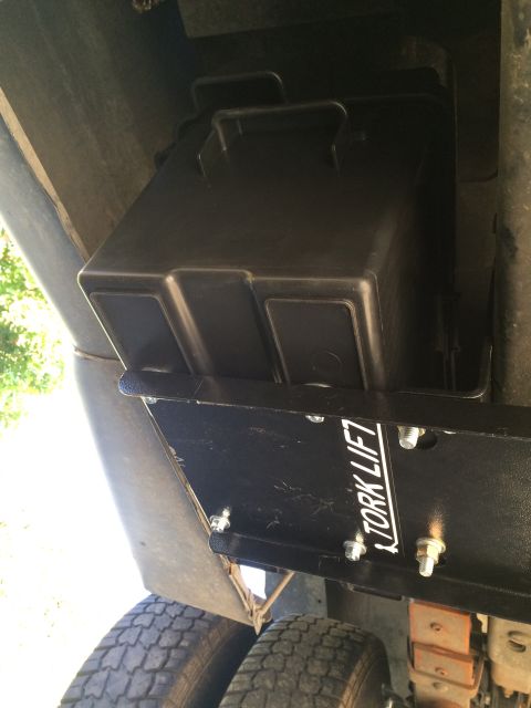 1997 Dodge 3500 - A Tork Lift battery box is visible mounted beneath a vehicle with dual rear wheels.