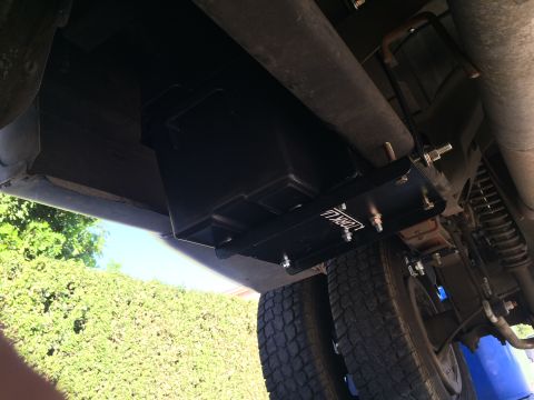 1997 Dodge 3500 - Aftermarket underbody fuel tank installation with a visible "TORQLL" logo plate and dual rear wheels.