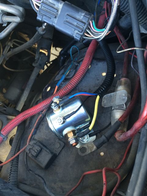 1997 Dodge 3500 - Close-up view of a vehicle's starter relay and associated wiring harness in the engine compartment.