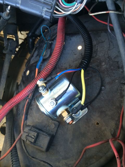 1997 Dodge 3500 - Close-up view of a starter relay and associated wiring, including red and yellow cables.