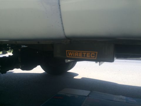 1997 Dodge 3500 - Wiretec accessory box mounted under the vehicle's frame near the rear axle.