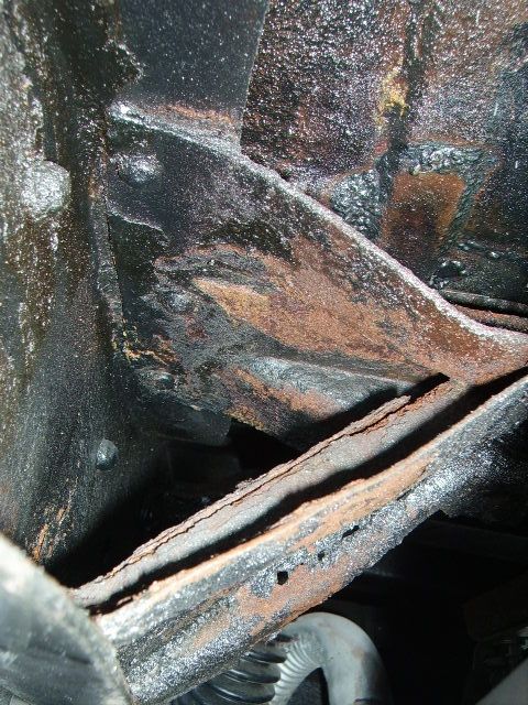 1978 Ford Bronco - Close-up view of heavily rusted frame components, with a watermark indicating the source as Supermotors.net.