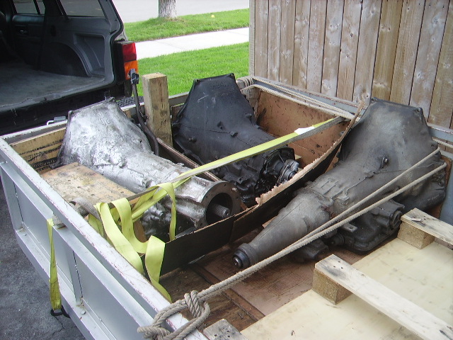 Three transmissions loaded in a truck bed