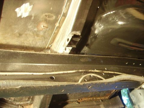 1978 Ford Bronco - Close-up of vehicle undercarriage, showing frame structure and wiring.