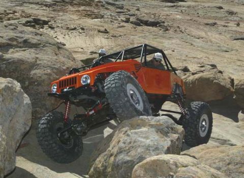 1990 Ford Bronco - This custom-built rock crawler navigates a challenging boulder-strewn course.