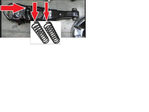 1973 Ford Ranchero - Two black coil springs are shown next to a black automotive suspension control arm. Red arrows point to areas on the control arm.