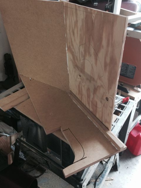 1979 Ford Bronco - A partial view of a wooden structure, possibly a custom enclosure or speaker box, is shown in a workshop setting. The structure is made of…