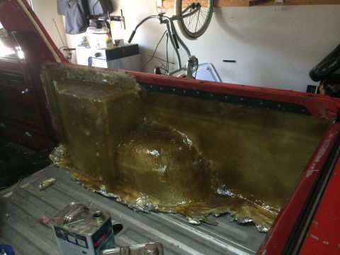 1979 Ford Bronco - A custom fiberglass enclosure is being built inside the bed of a red pickup truck. The enclosure appears to be a mold for a speaker box or…