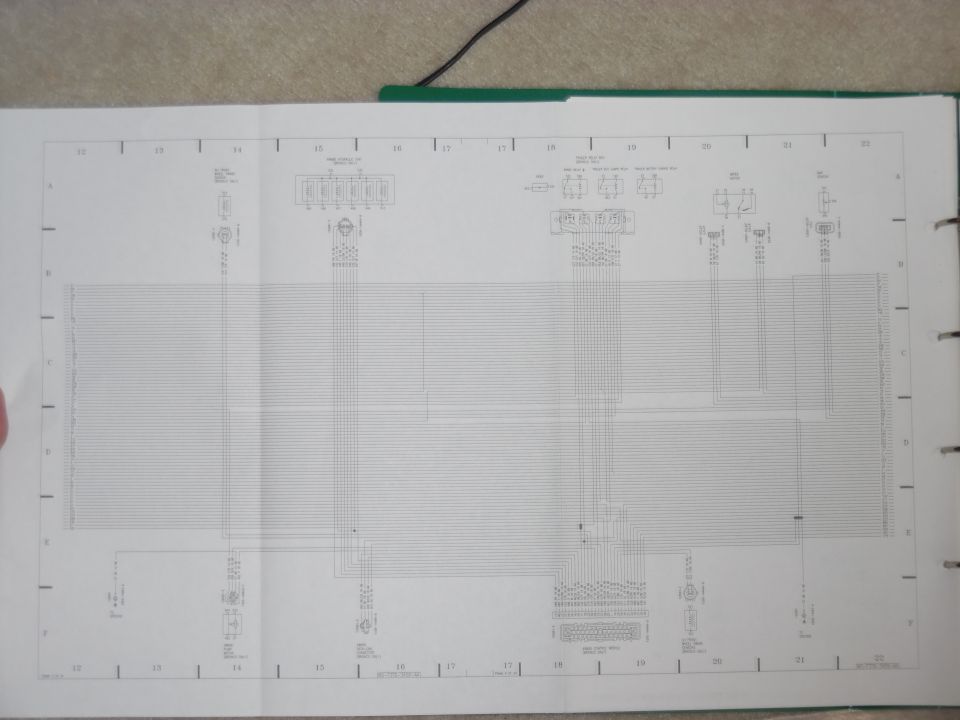 Fold-out factory wiring diagram page, grid columns 12-22, in a green service manual binder