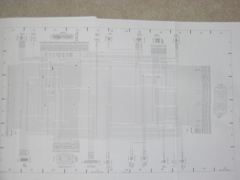 Fold-out automotive wiring diagram page with numbered grid and connector pinouts