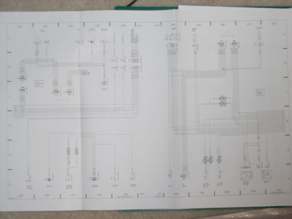 Fold-out factory wiring diagram spread, grid sections 122-132, with switch and connector circuits