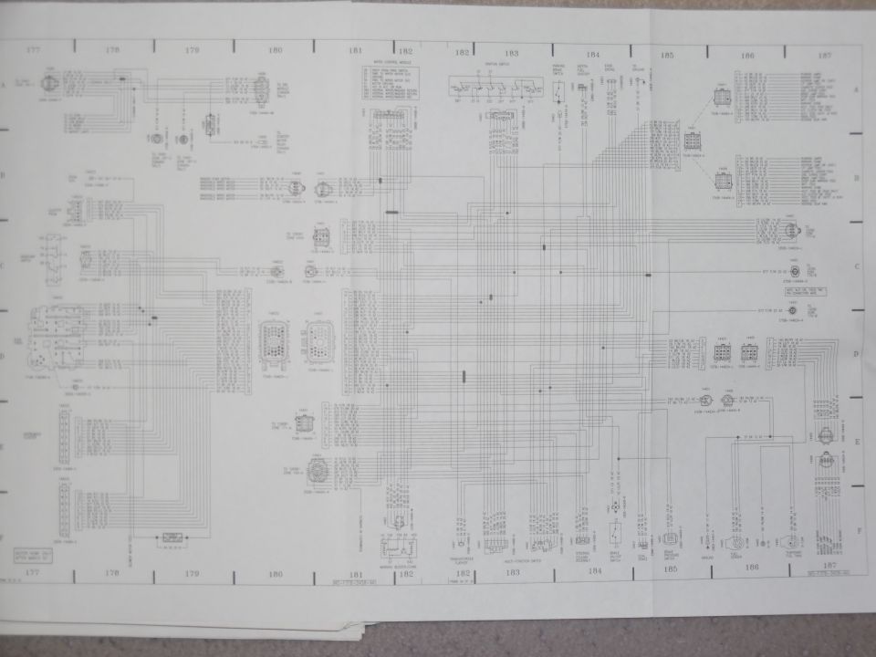 Fold-out factory wiring diagram spread, grid sections 177-187, with module and connector pinouts