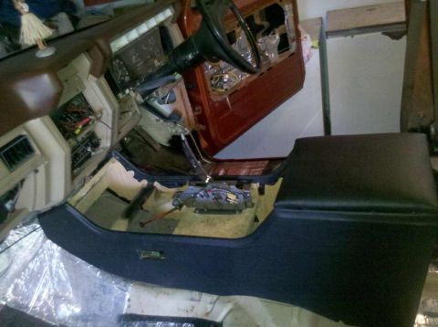 1982 Ford Bronco - The interior of a vehicle is shown partially disassembled, with components removed for restoration or repair.