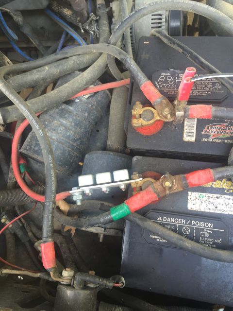 1993 Ford Bronco - Vehicle battery and wiring detail, showing terminals and a fuse block.