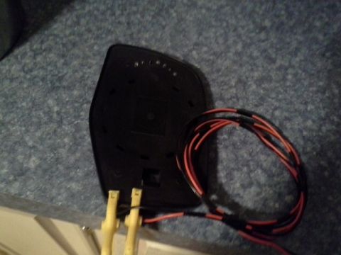 1993 Ford Bronco - This is a close-up of the back of a car mirror housing, showing exposed wiring.