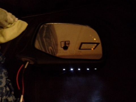 1993 Ford Bronco - Side mirror reflection shows icons, including a camera and a light indicator.