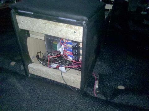 1982 Ford Bronco - A custom-built electrical relay and fuse box enclosure is visible, constructed from wood and upholstered with black material. The enclosure…