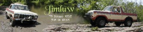 1979 Ford Bronco - Two 1979 Ford Broncos navigate a challenging muddy off-road course.