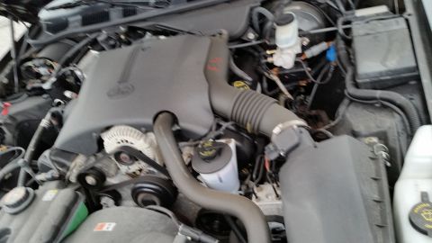 2001 Ford Crown Victoria - The engine compartment of a 2001 Ford Crown Victoria, the V8 engine and associated components.