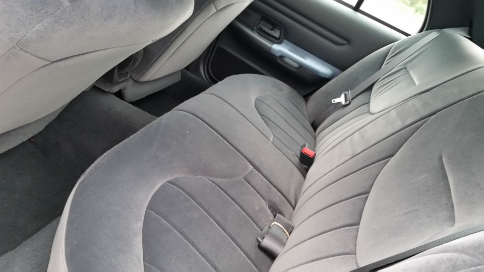 Gray fabric rear seats and floor of a 2001 Ford Crown Victoria