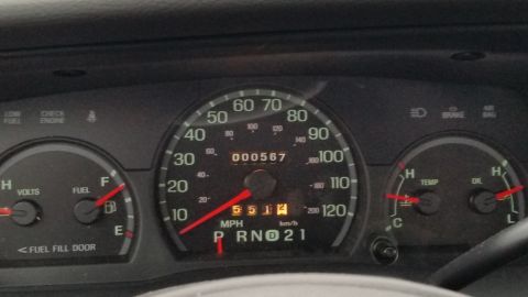 2001 Ford Crown Victoria - Dashboard gauges including speedometer, odometer, trip meter, fuel, temperature, and oil levels are visible.