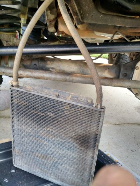 1992 Ford Bronco - A transmission cooler is shown, disconnected and ready for installation or removal from the underside of a vehicle.