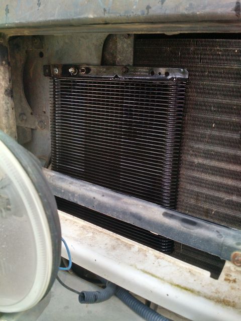 1992 Ford Bronco - Transmission cooler installed in front of the radiator assembly.