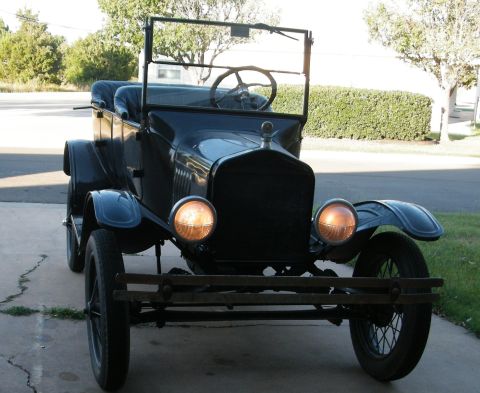 1923 Ford Model T - A classic 1923 Ford Model T is parked outside on a paved driveway.