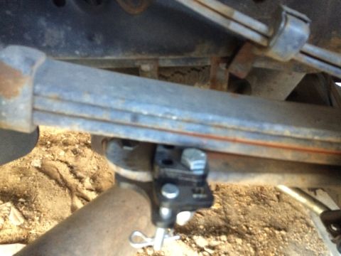 1997 Dodge 3500 - A close-up view of the undercarriage shows the vehicle's leaf springs and exhaust system.