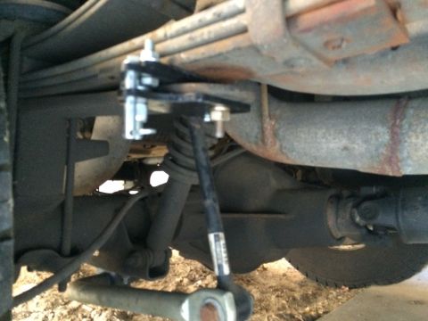1997 Dodge 3500 - Close-up of an aftermarket suspension part installed on a vehicle's rear axle.