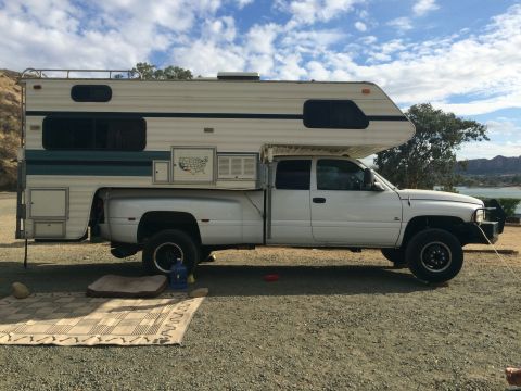 1997 Dodge 3500 - Side view of a 1997 Dodge Ram 3500 pickup truck fitted with a camper shell.
