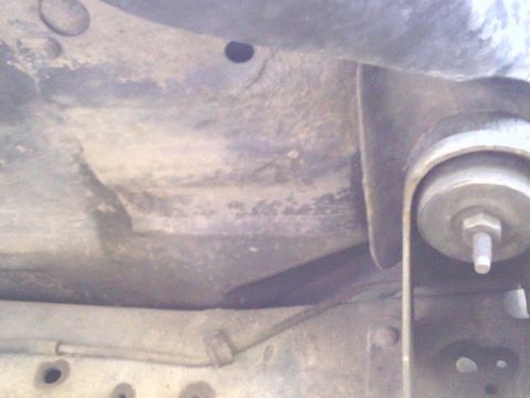 1978 Ford Bronco - Close-up view of the vehicle's underbody, showing suspension parts and a watermark.