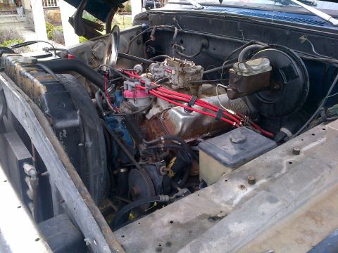 1978 Ford Bronco - Close-up view of a vehicle's engine bay, showing the engine components and radiator.