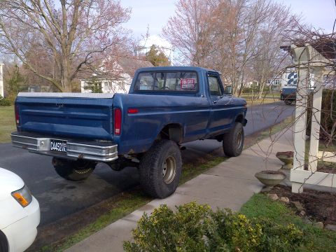 1978 Ford Bronco - This blue pickup truck appears to be a 1979 model, not a 1978 Ford Bronco.