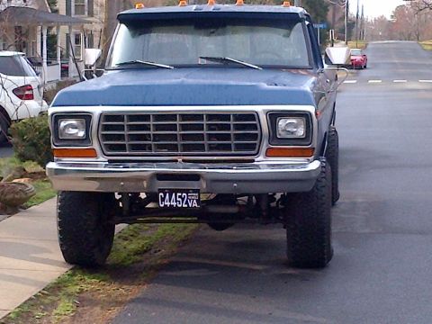 1978 Ford Bronco - This 1978 Ford F-Series truck has a prominent grille and large off-road tires.